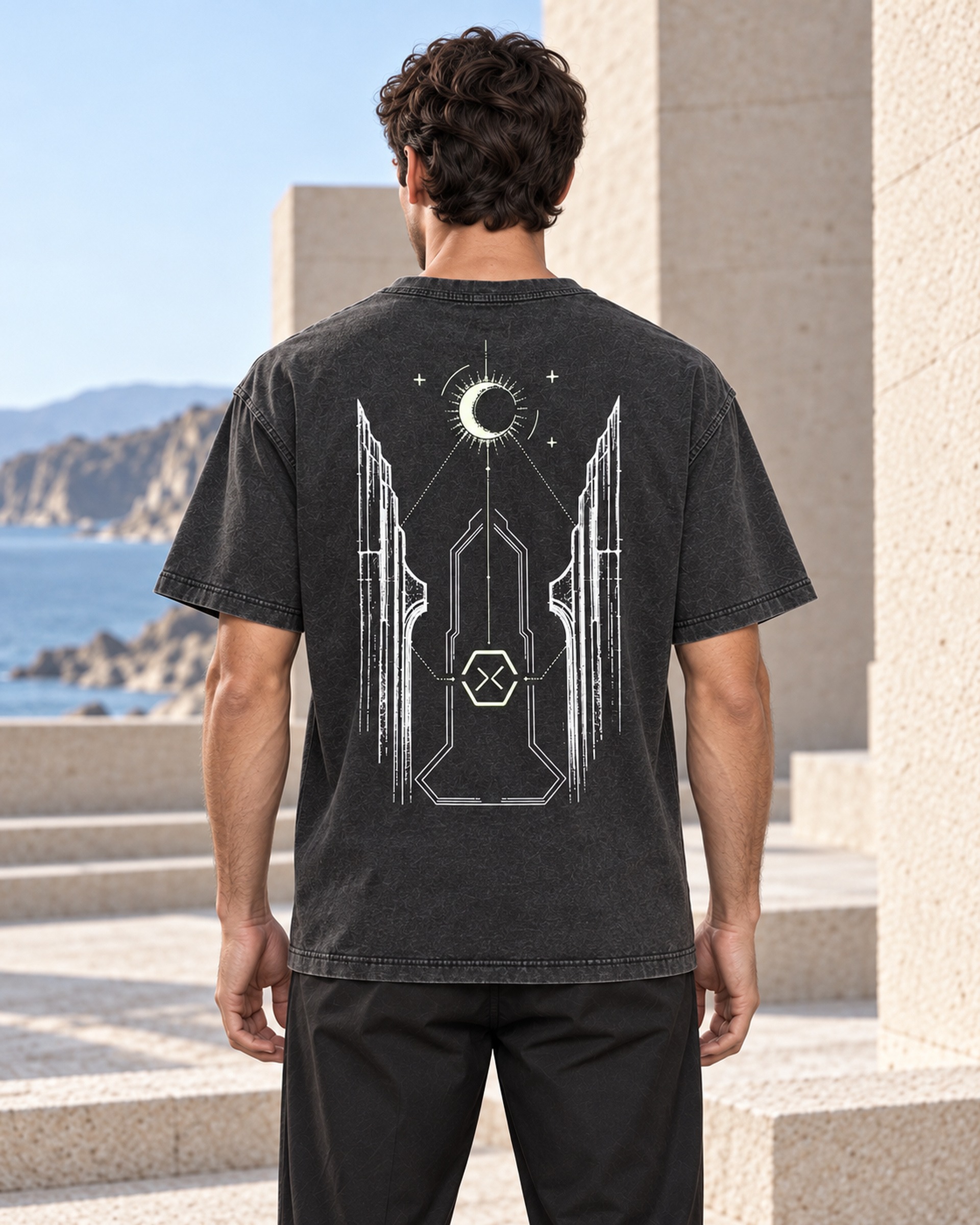 Adult wearer showing the complete architectural back artwork of NOCTURNE 01 in Washed Carbon.