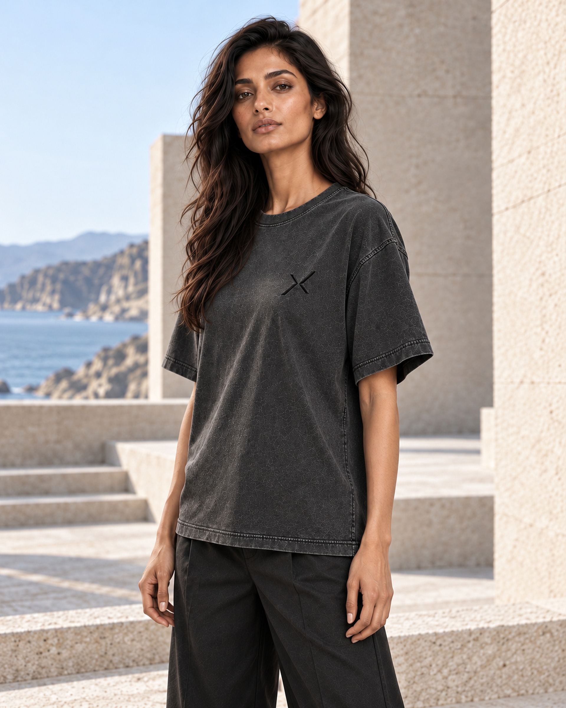 Three-quarter front view of NOCTURNE 01 showing the dropped shoulder, sleeve and chest signature.