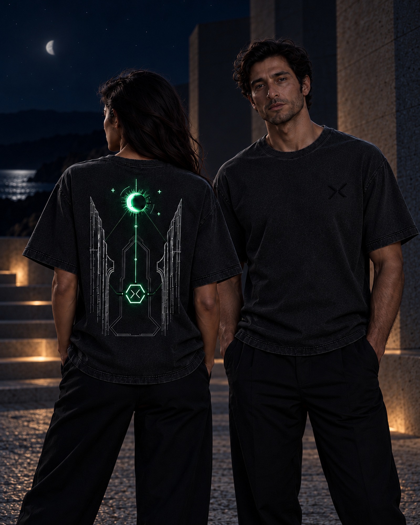 Two adult wearers in low light, with selected elements of THE VEIL back print shown in green.